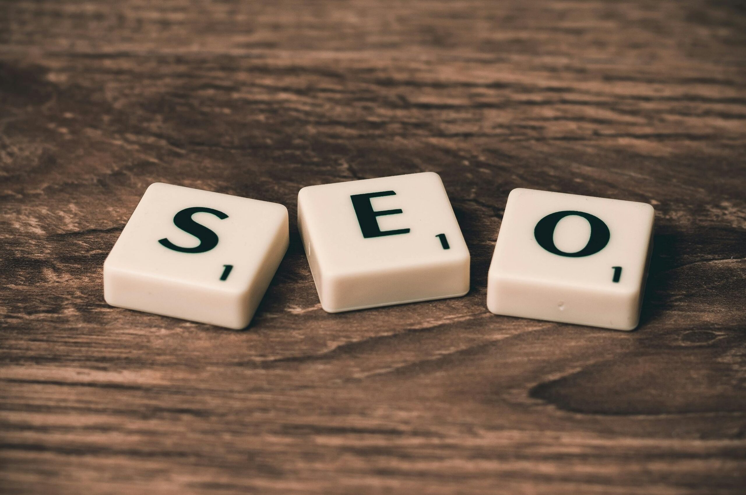 Pieces of Dominos forming the word "SEO"